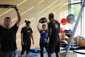 A group having health and fitness training with a personal trainer